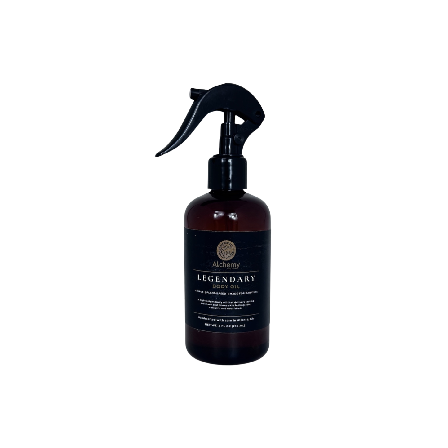 An amber spray bottle with a black trigger sprayer and a black label of Alchemy Body Werks Legendary Body Oil on a white background.