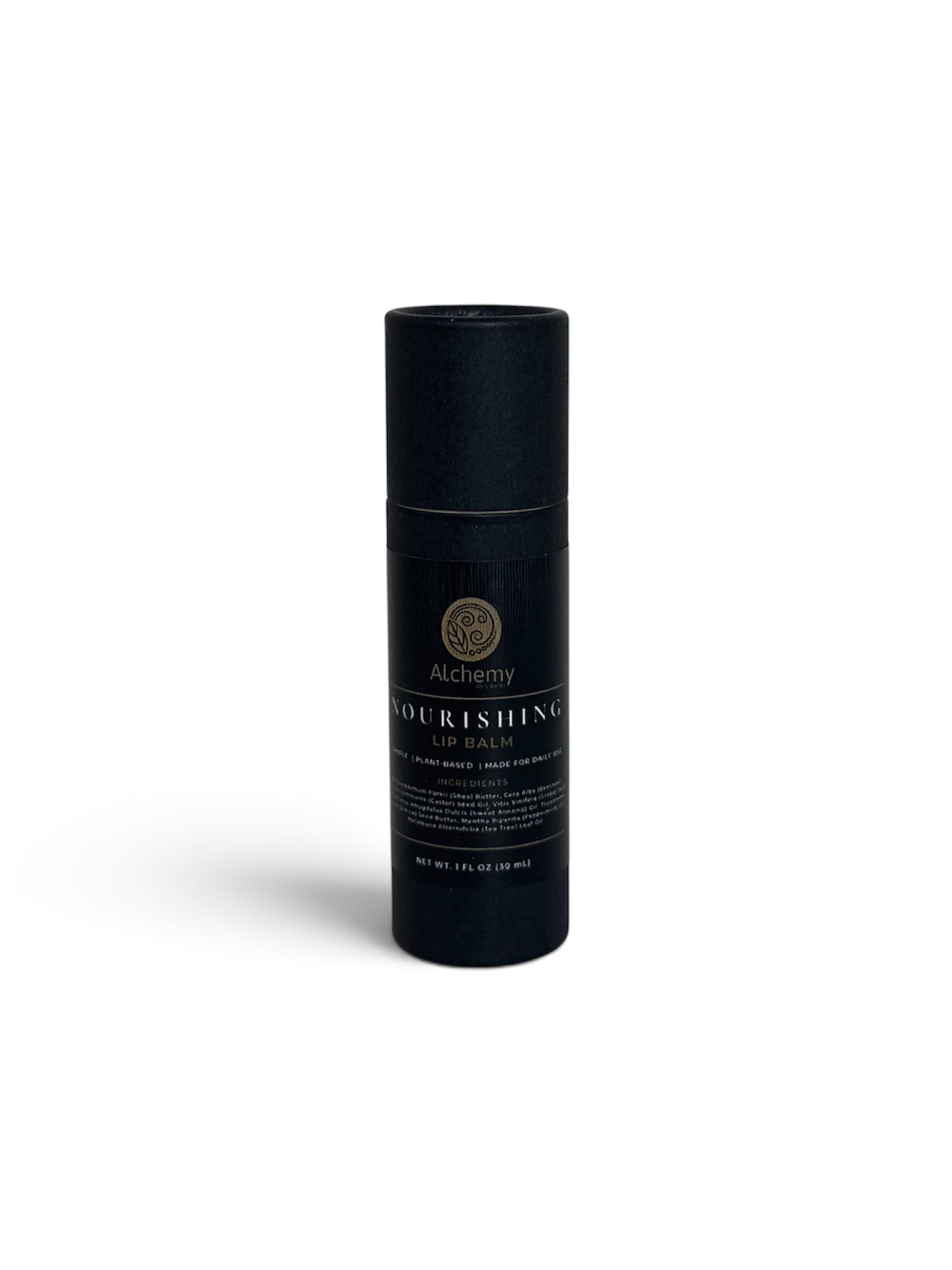 A black kraft push up container with a black label of Alchemy Body Werks Nourishing Lip Balm