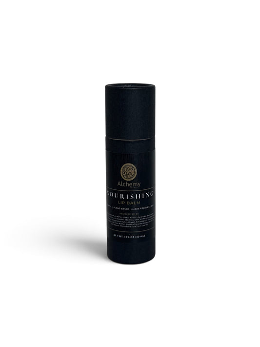 A black kraft push up container with a black label of Alchemy Body Werks Nourishing Lip Balm