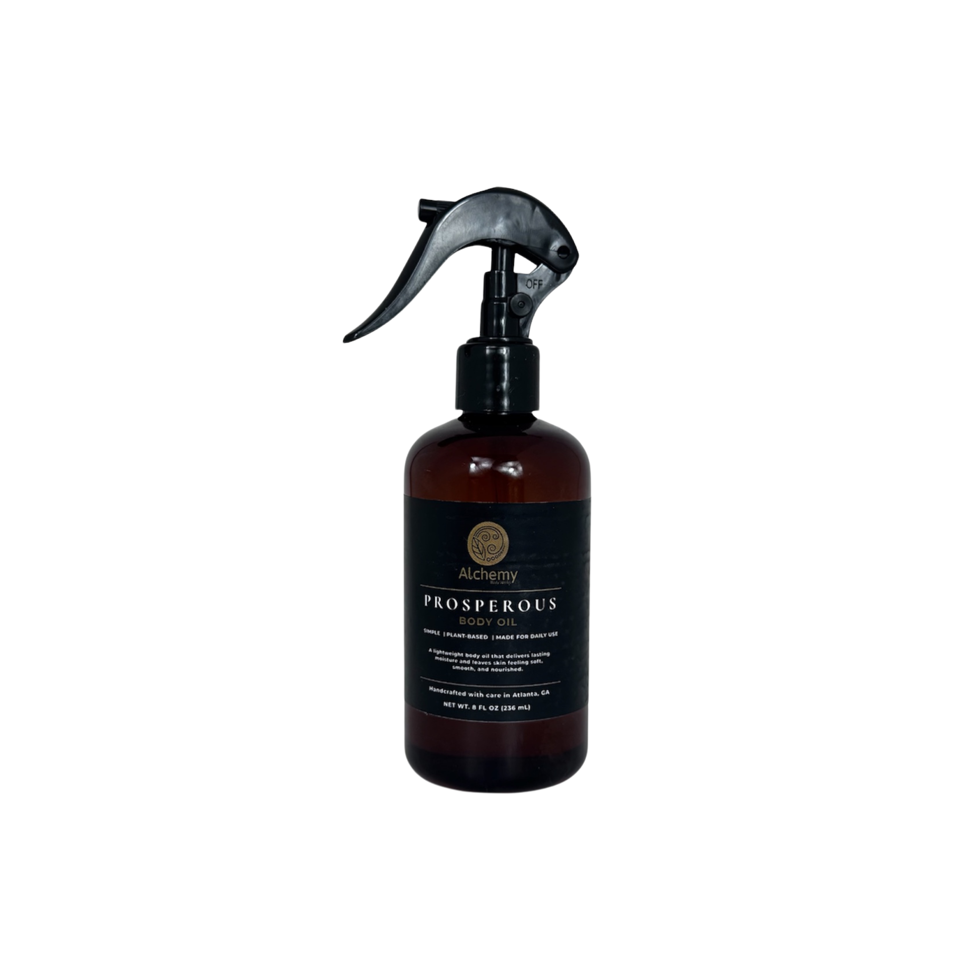 An amber spray bottle with a black trigger sprayer and a black label of Alchemy body Werks Prosperous Body Oil on a clean white background.